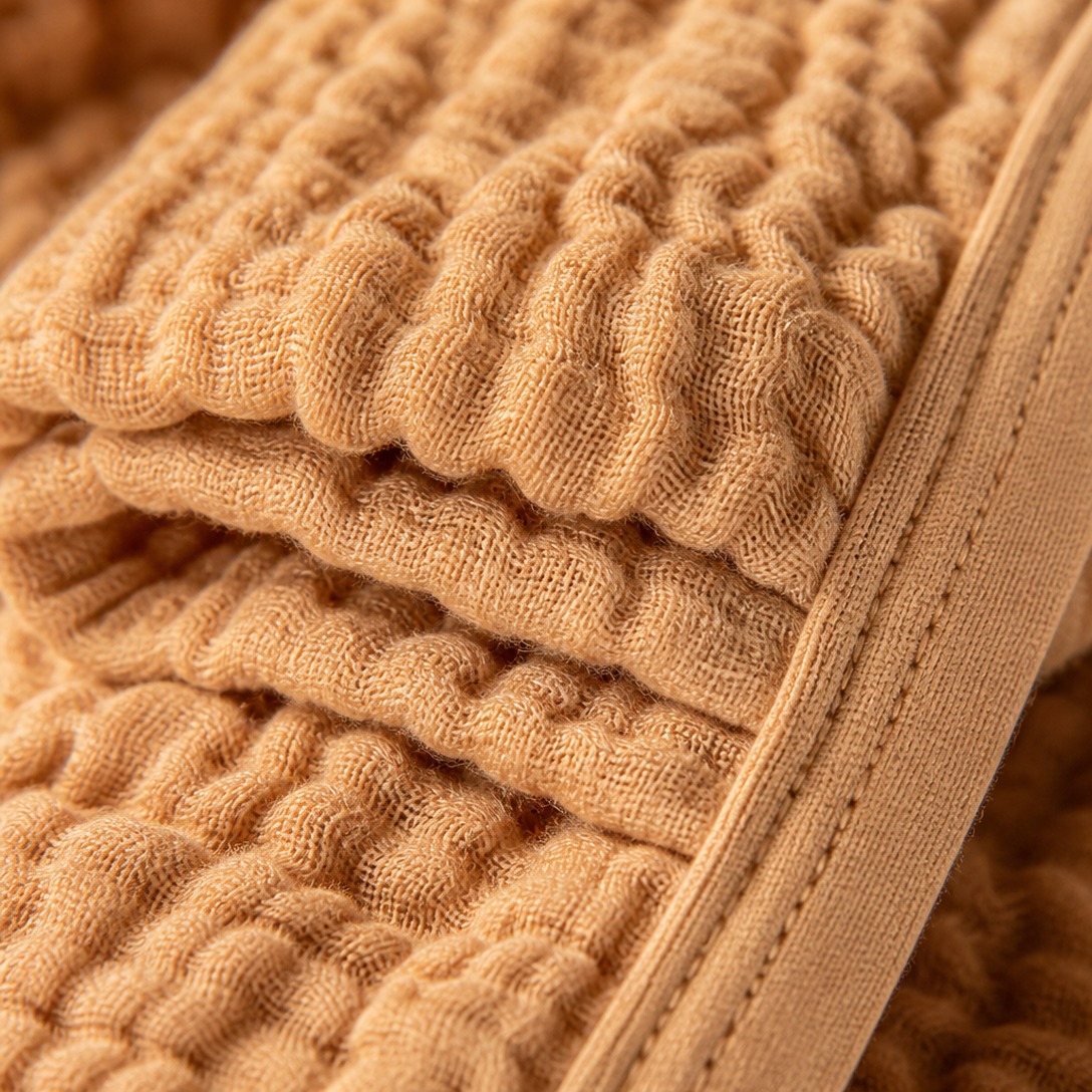Close view of the open weave of a four layer cotton muslin blanket