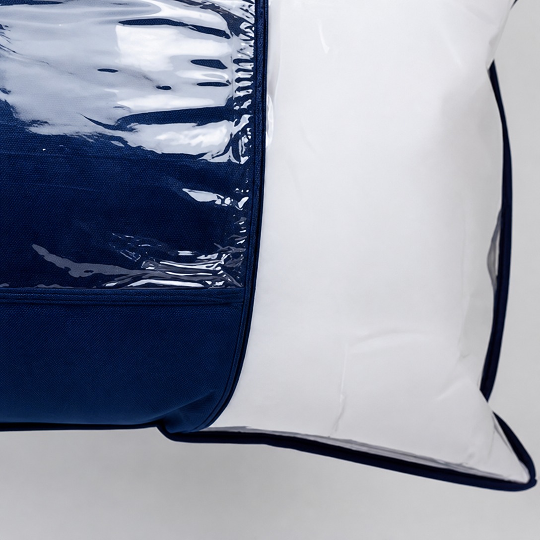 Close-up of clear PVC window edge and navy bound trim on a bedding storage bag - Comfytouch